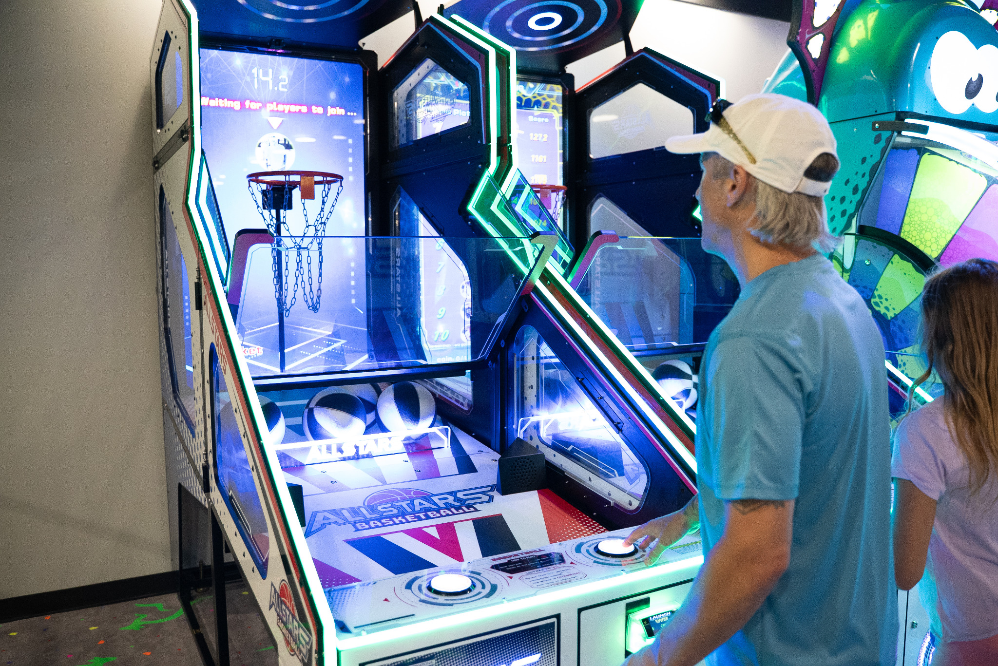 Guests playing arcade basketball